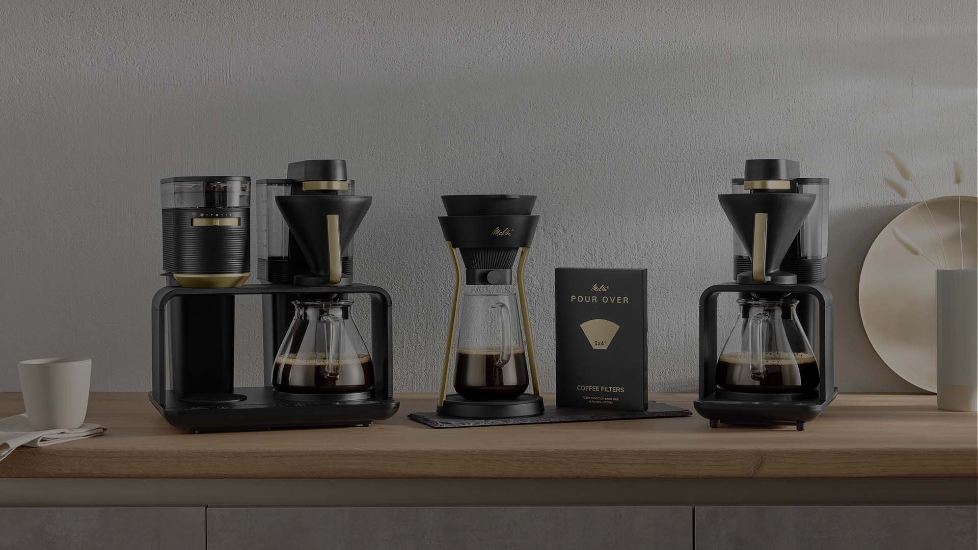 Melitta® AMANO: elegant design in black and gold, with the matching Melitta® BLOOM® coffee and Melitta® Pour Over 1X4® filter